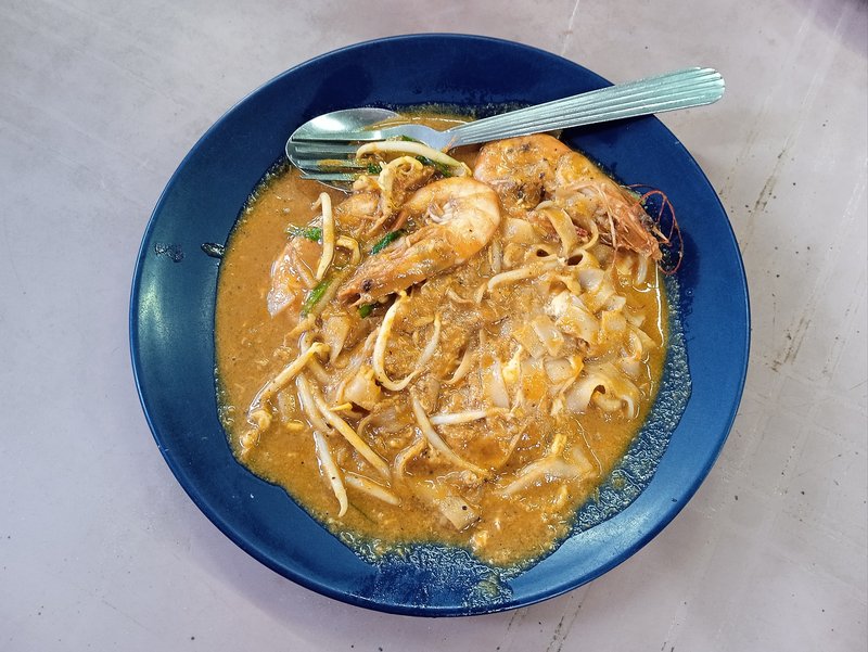 Char Kway Teow stir-fried flat noodles with prawns and egg in dark soy sauce