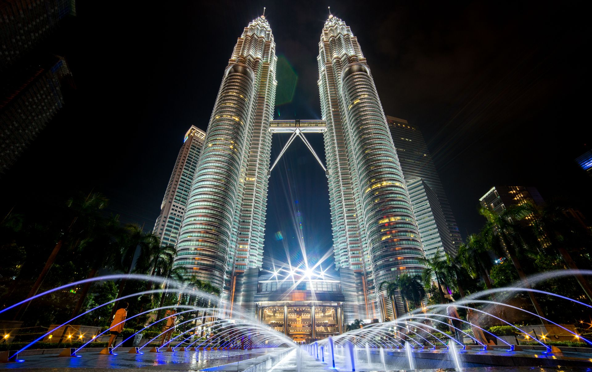 Kuala Lumpur Petronas Towers at twilight with dramatic sky