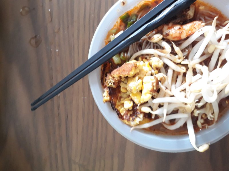 Sarawak Laksa spicy noodle soup with prawns and coconut broth