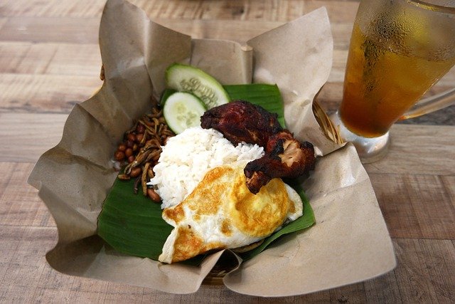 Nasi Lemak Malaysian coconut rice with sambal anchovies and egg on banana leaf